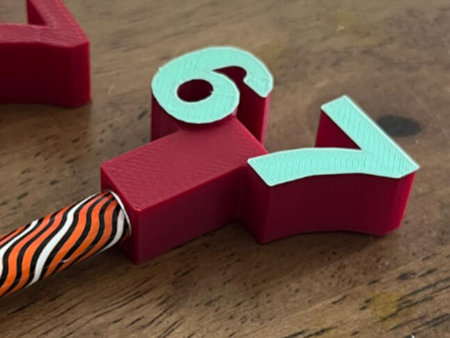67 pencil topper £1